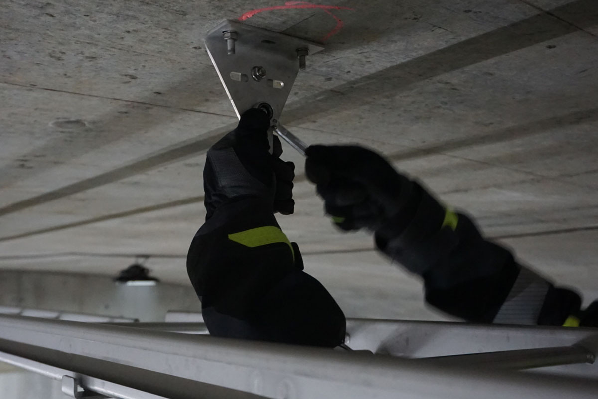 Trial installation of cable ladder in tunnel ceiling within the Stockholm Bypass project.
